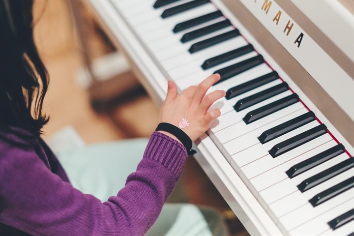 Child playing a piano