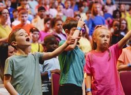 Primary school aged children singing